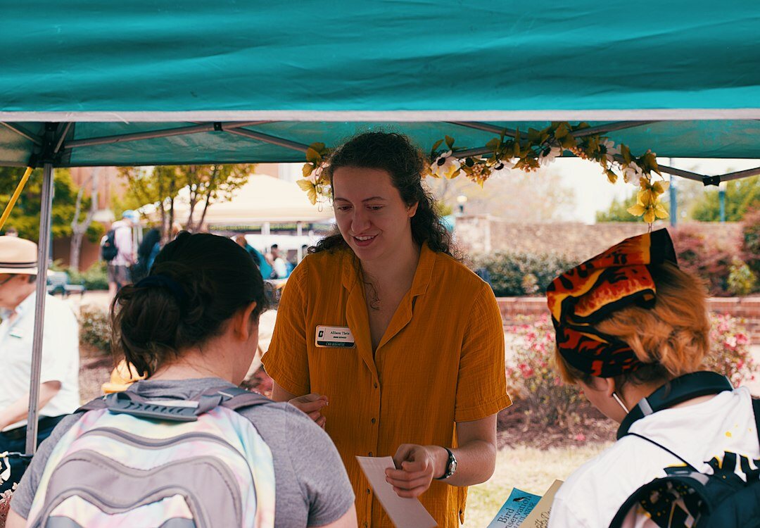 Volunteers interviewing a resident in a Chilean neighborhood