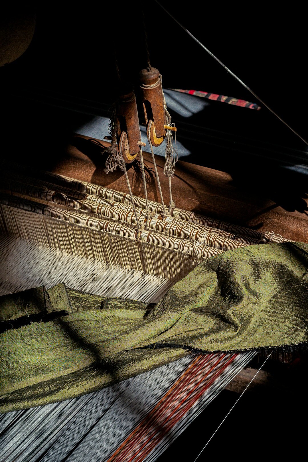 Artisan weaving traditional textiles by hand