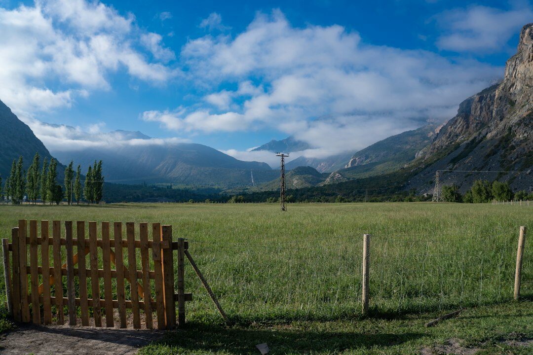 Chilean farmer working in a green agricultural valley